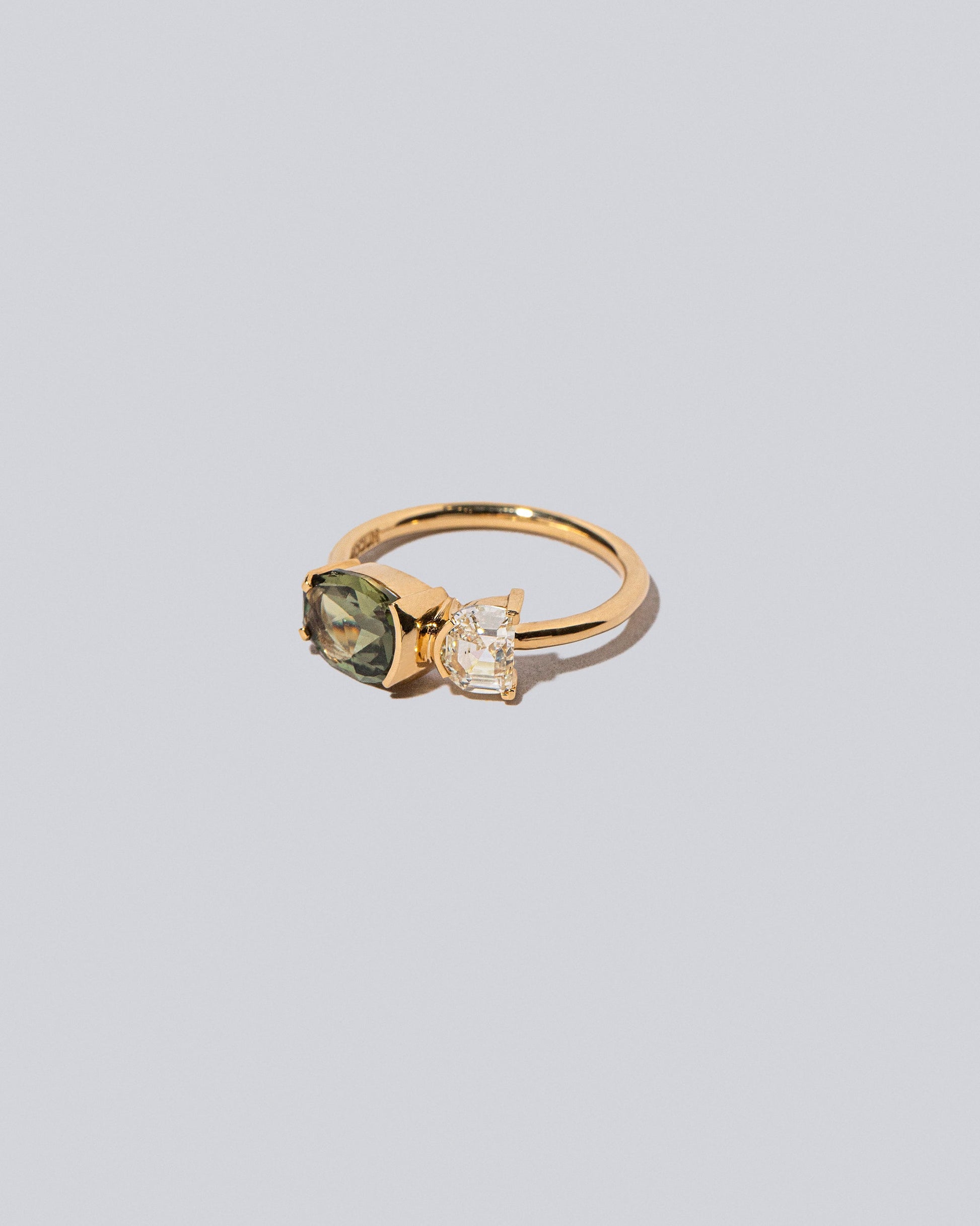 Product photo of Finch Ring on a light color background 