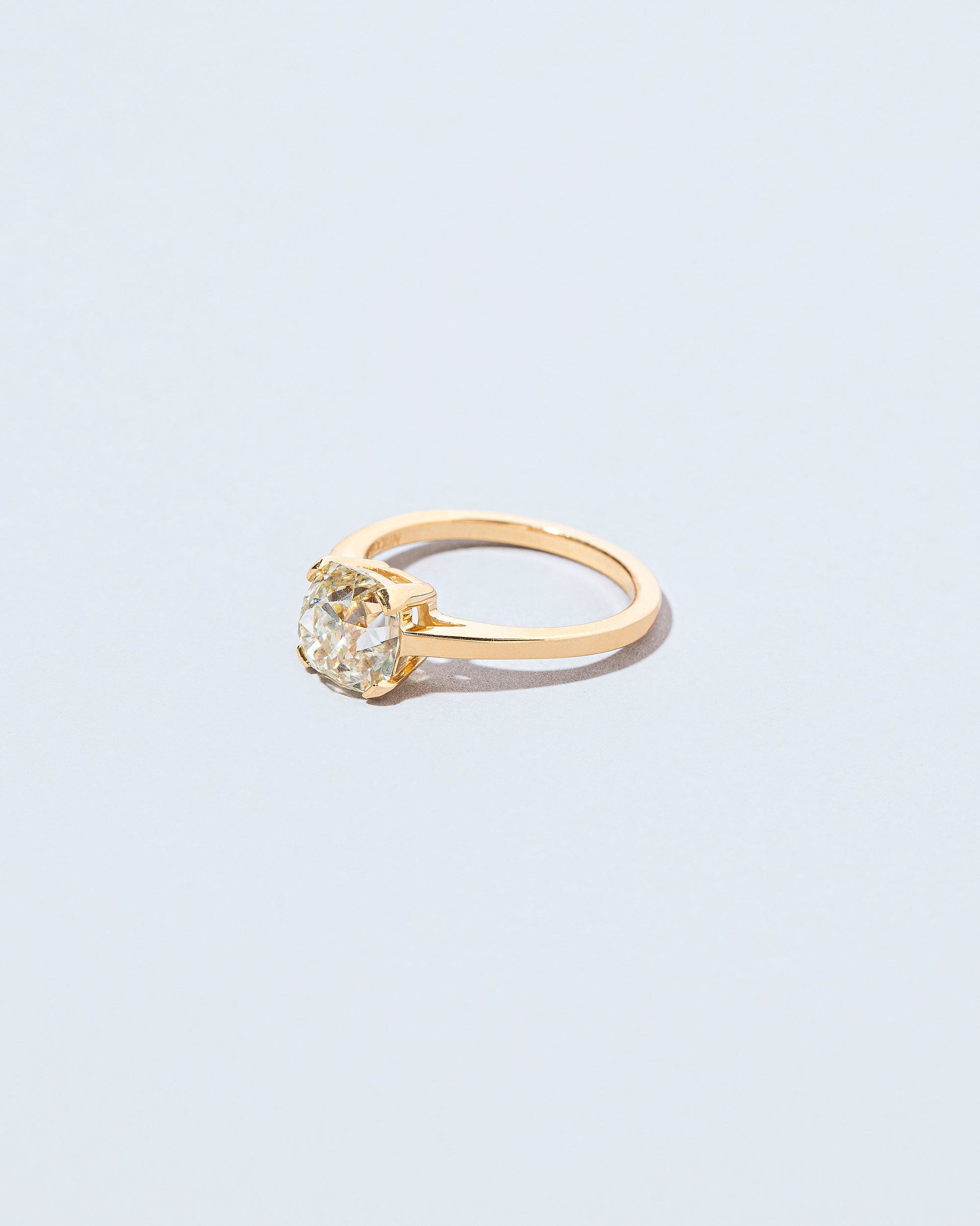 View from the side of the Ichor Ring on light color background.