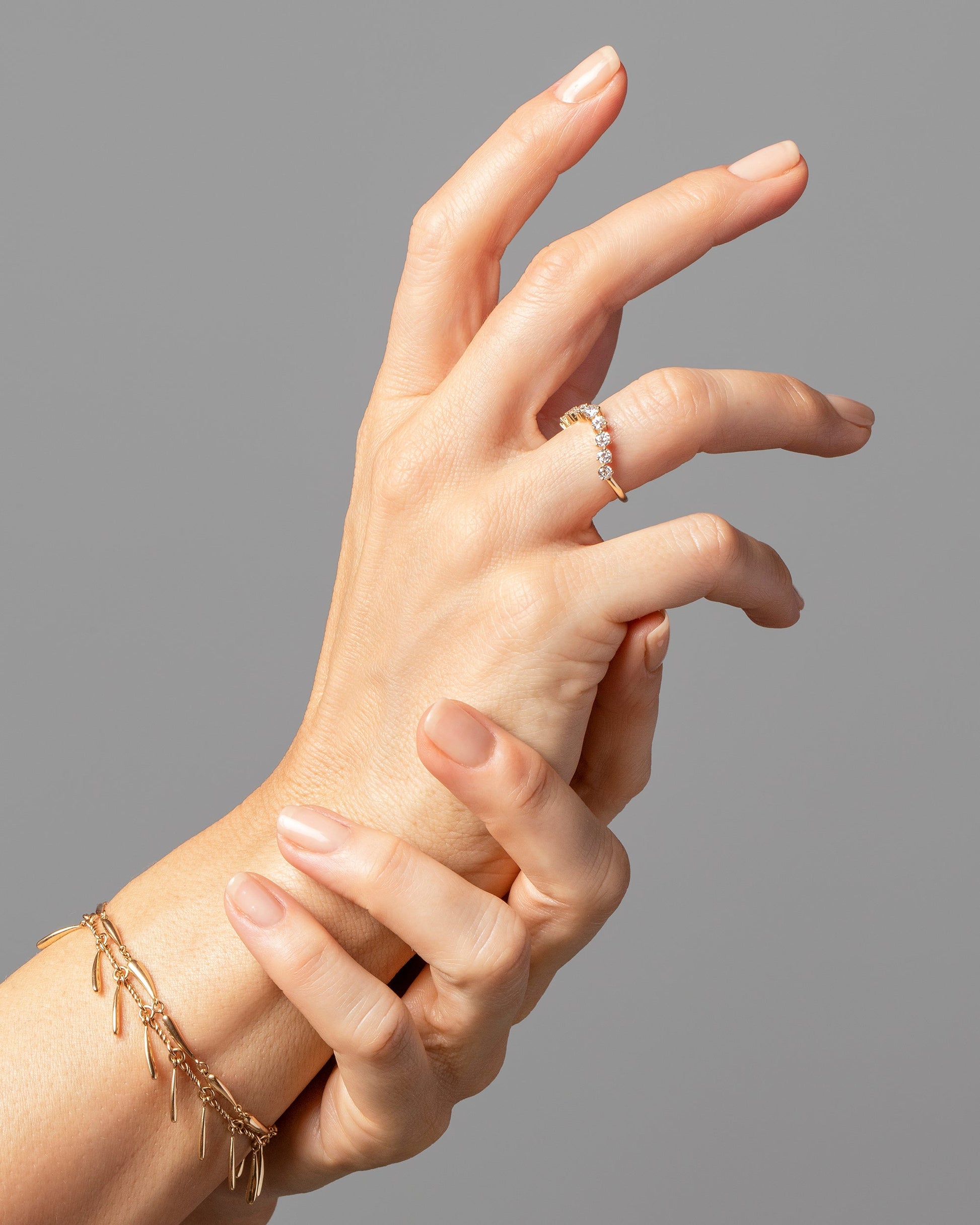 Gold Accumulation Bracelet, Swaying Bracelet and Diamond Swell Band on model.