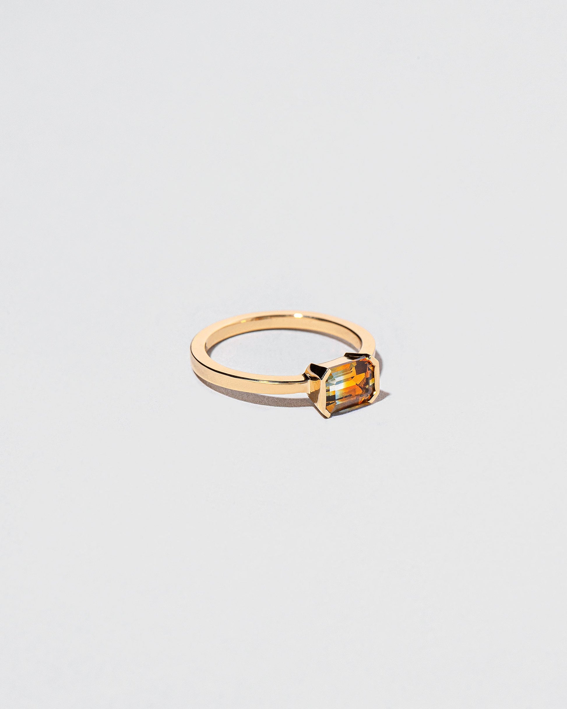View from the side of the Elowan Ring on light color background.