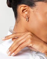 Dualism Earrings on model.