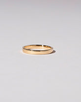 Gold 2.5mm Square Wire Band on light color background.