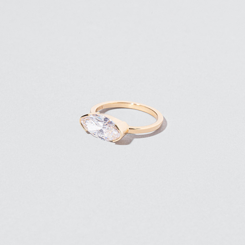 product_details::Closeup details of the Symmetry Ring on light color background.
