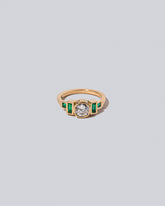 Diamond & Emerald Third Eye Ring on light colored background.