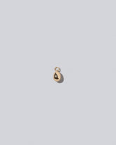 Egg Charm on light color background.