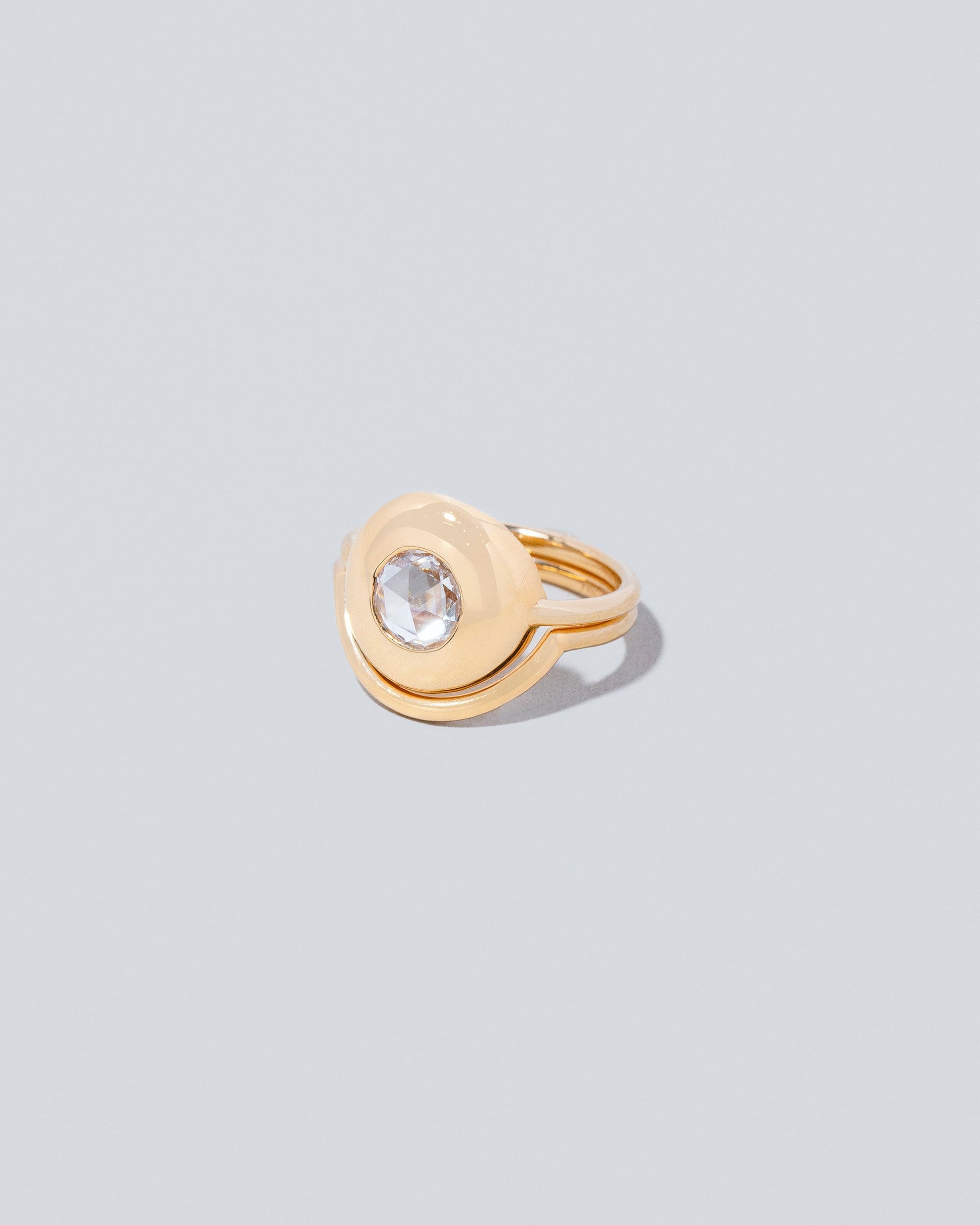 Exposition Ring with Exposition Band on light colored background.