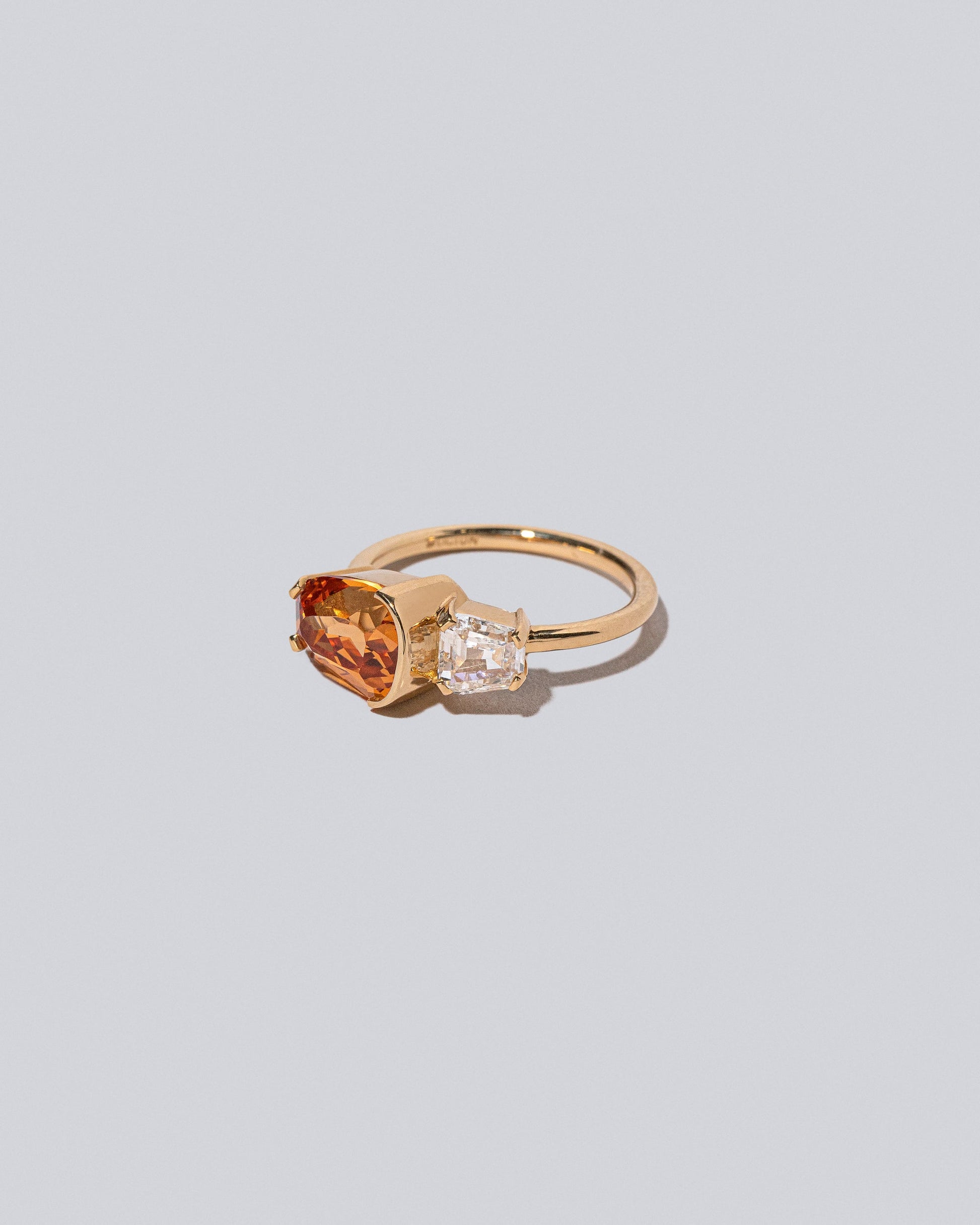 Product photo of Golden Poppy Ring on a light color background 
