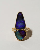 Australian Boulder Opal Ring on light color background.
