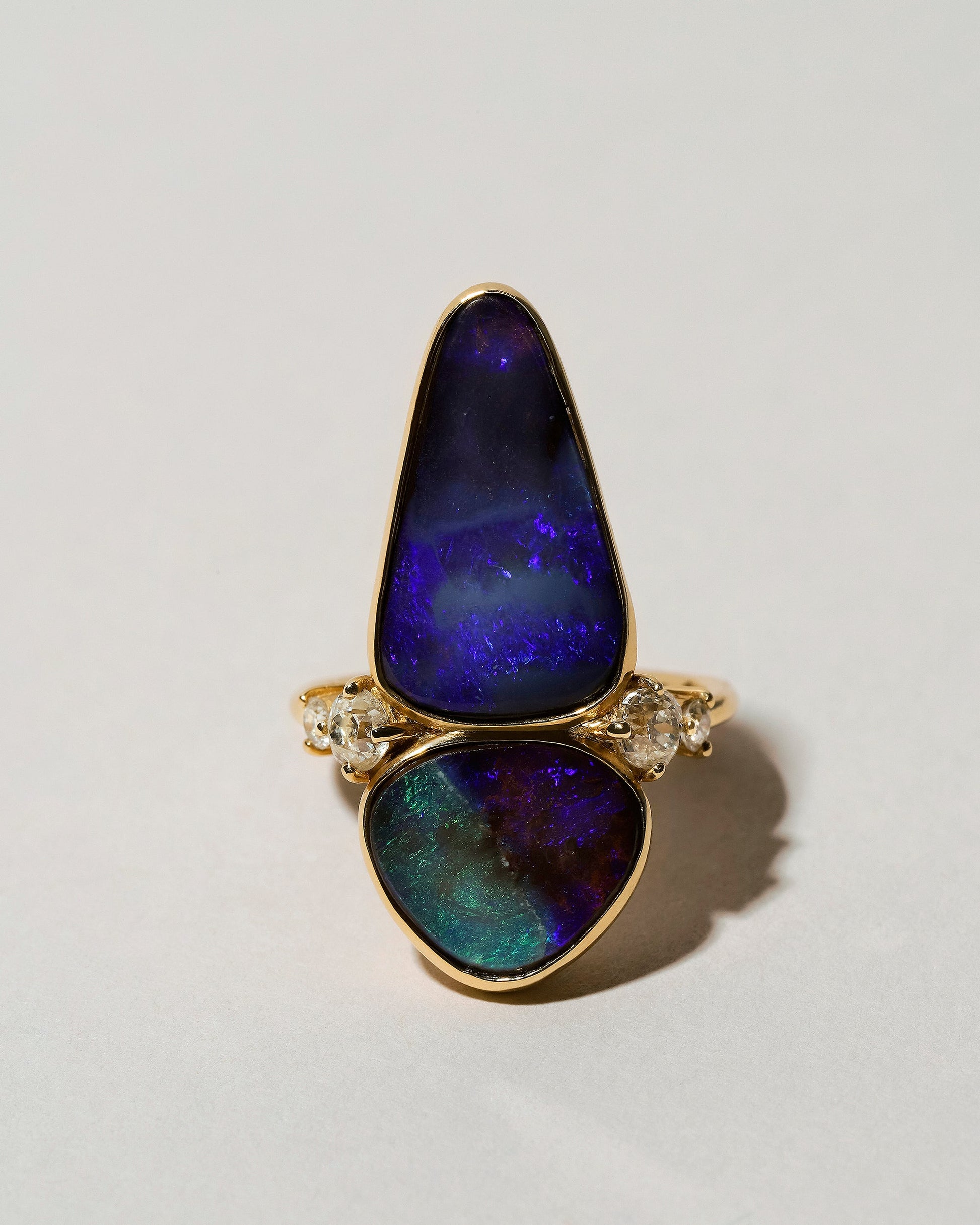 Australian Boulder Opal Ring on light color background.