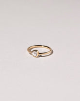 Rose Cut Pear Diamond Ring on light color background.