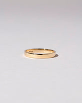 Gold 3mm Square Wire Band on light color background.