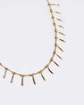  Swaying Necklace on light color background.