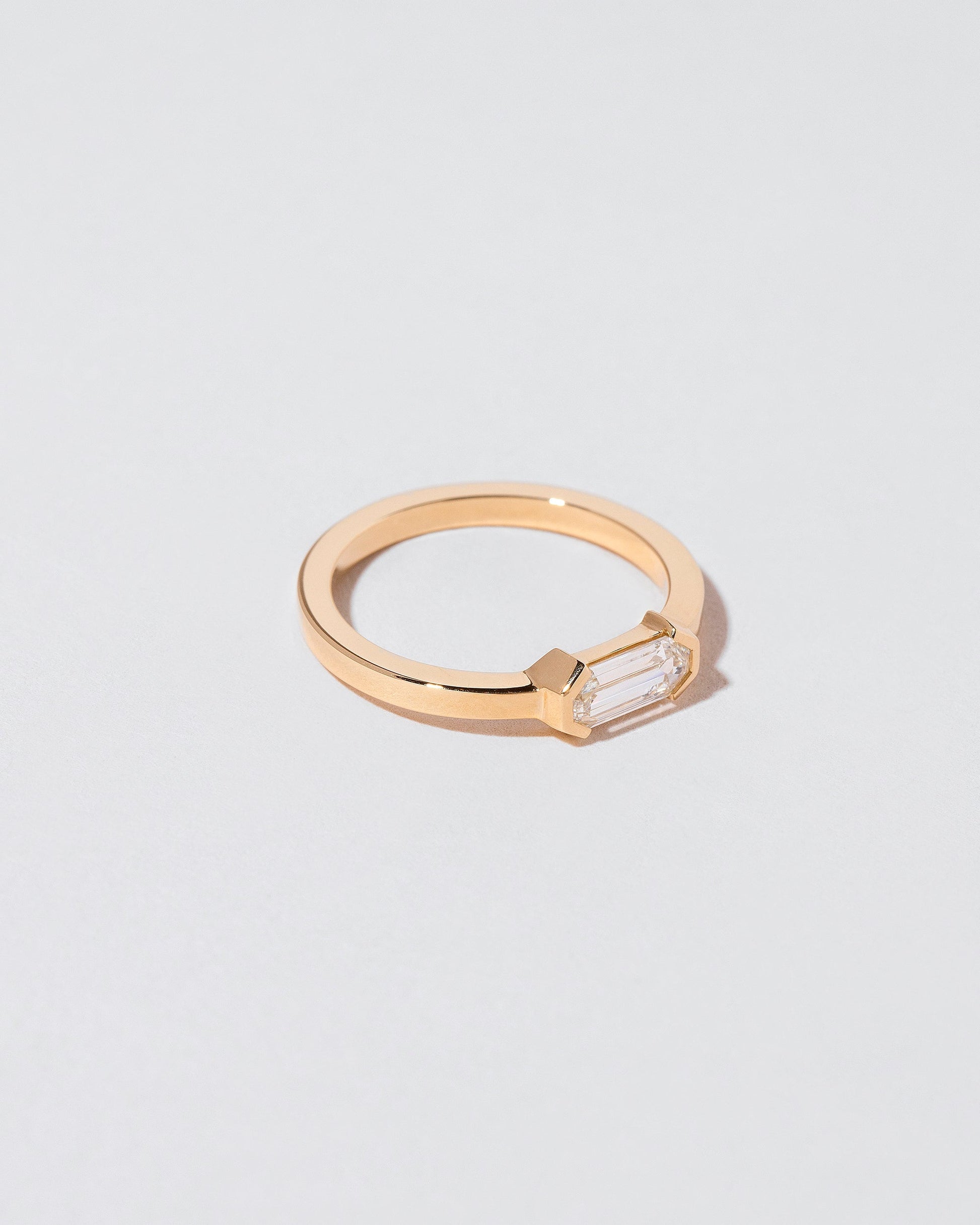 View from the side of the Alcon Ring on light color background.
