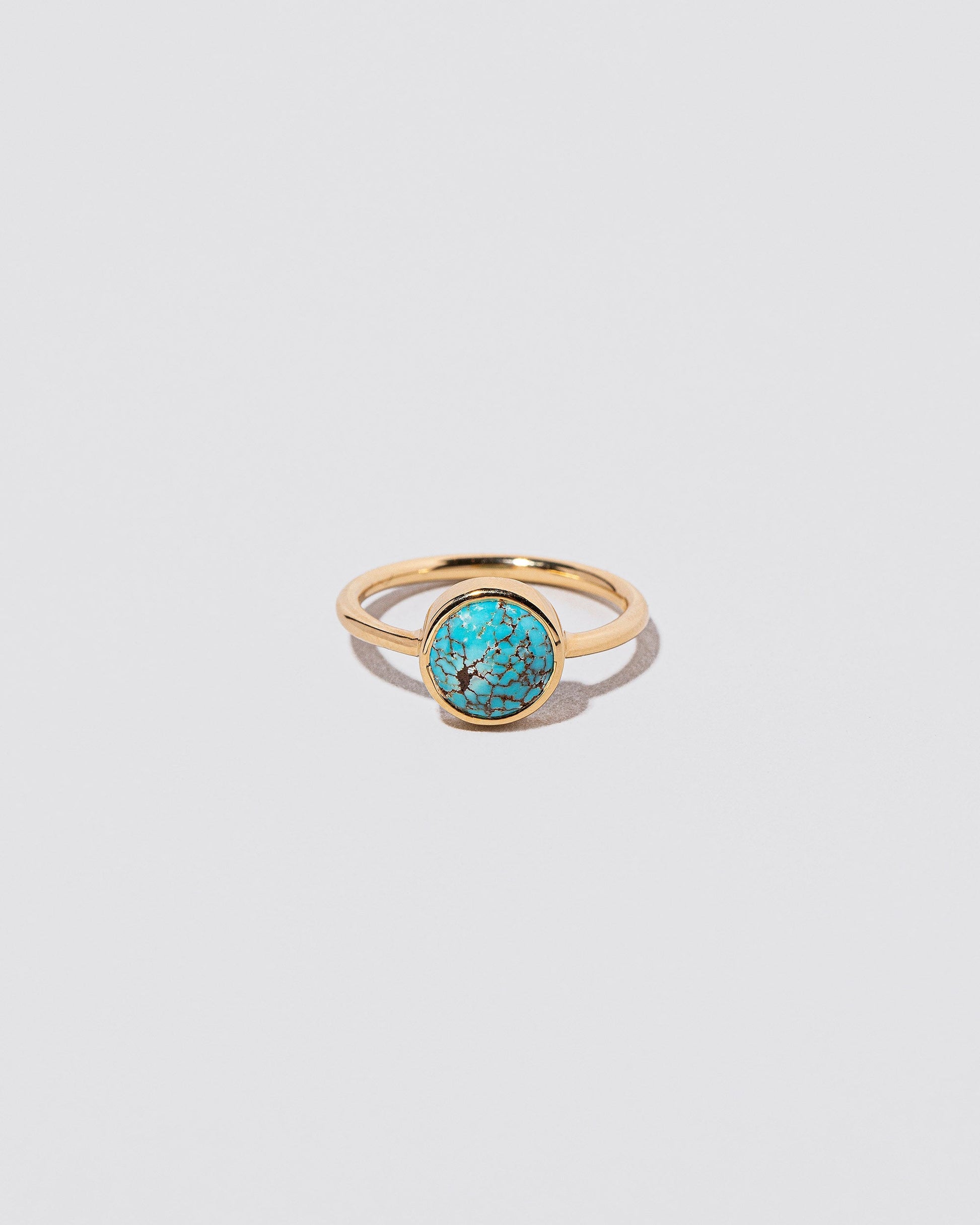 Wisdom Ring on light color background.