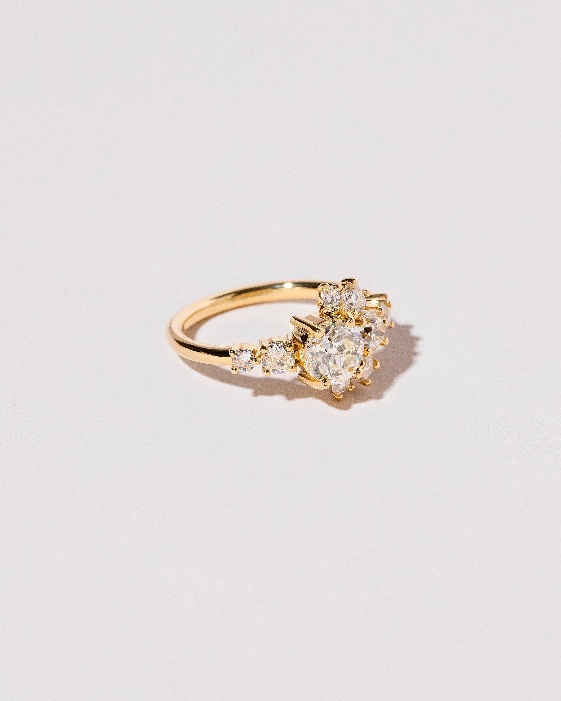  White Diamond Crescent Ring on light color background.