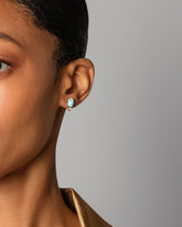 Divine Protection Earrings on model.