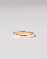 Gold 3mm Segmented Half Hoop Band on light color background.