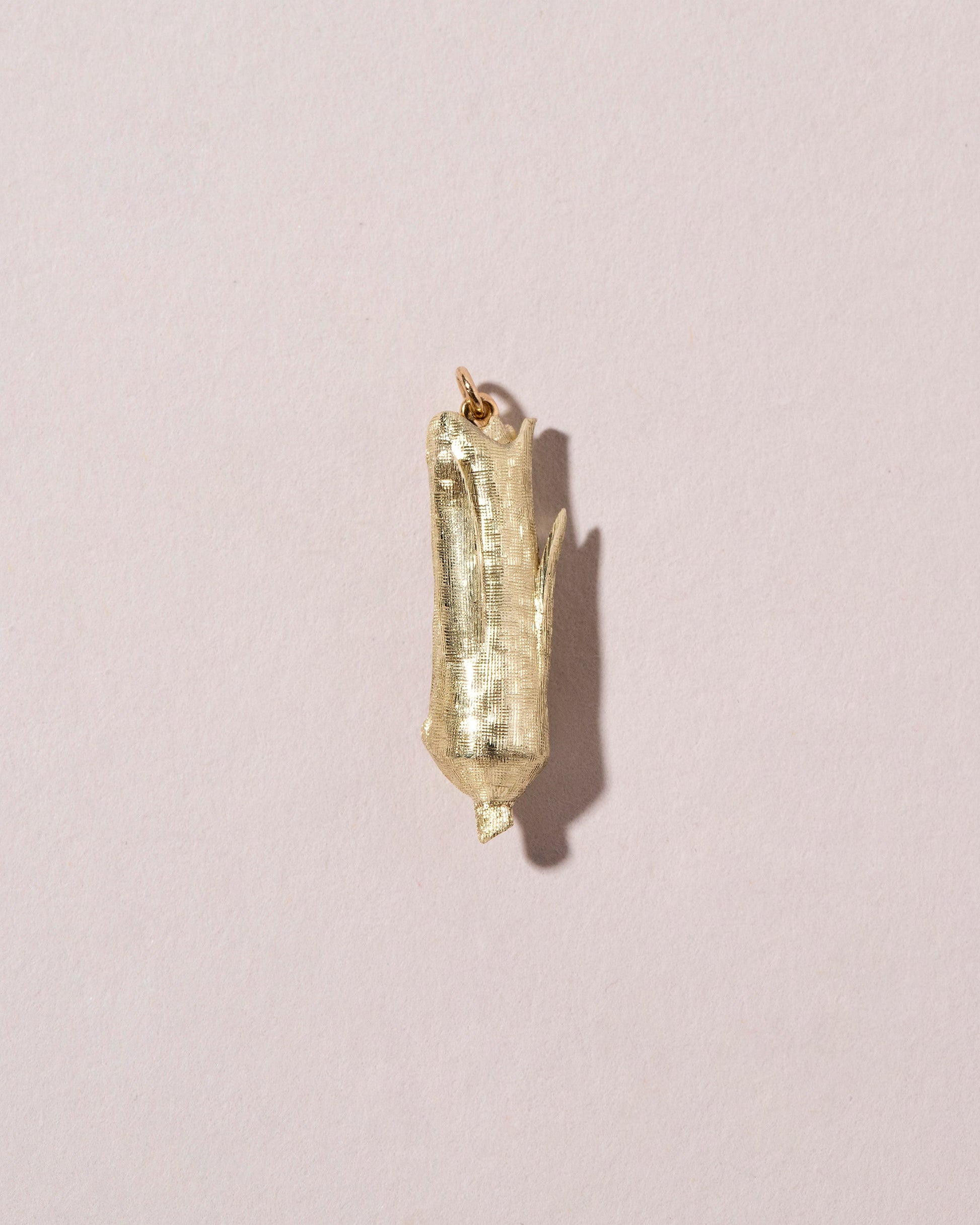  Corn on the Cob Charm on light color background.