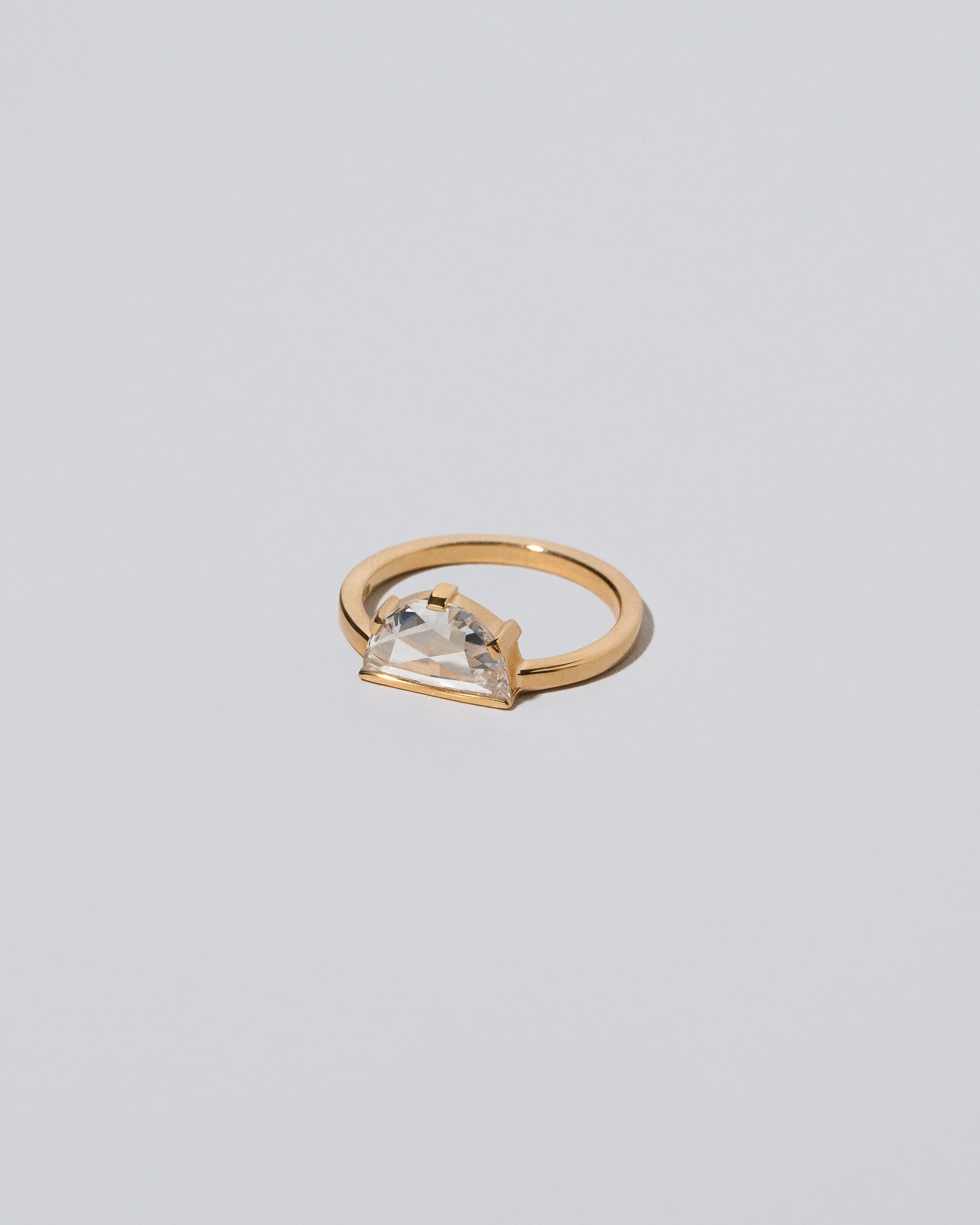 View from the side of the Plié Ring on light color background.