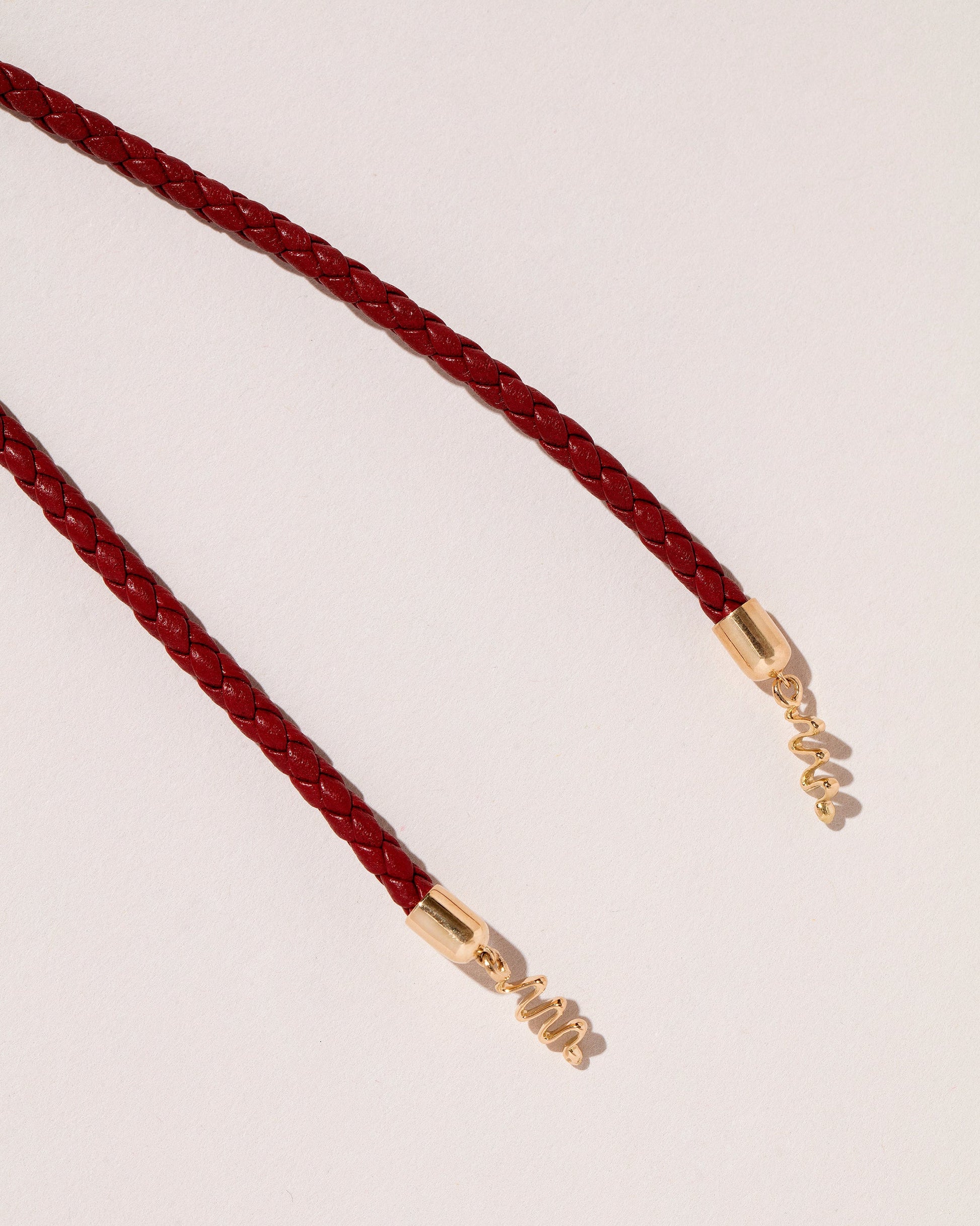 Closeup details of the Pearl Snake Bolo on light color background.