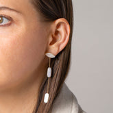 product_details:: Candy Bar Pearl Drop Earrings on model