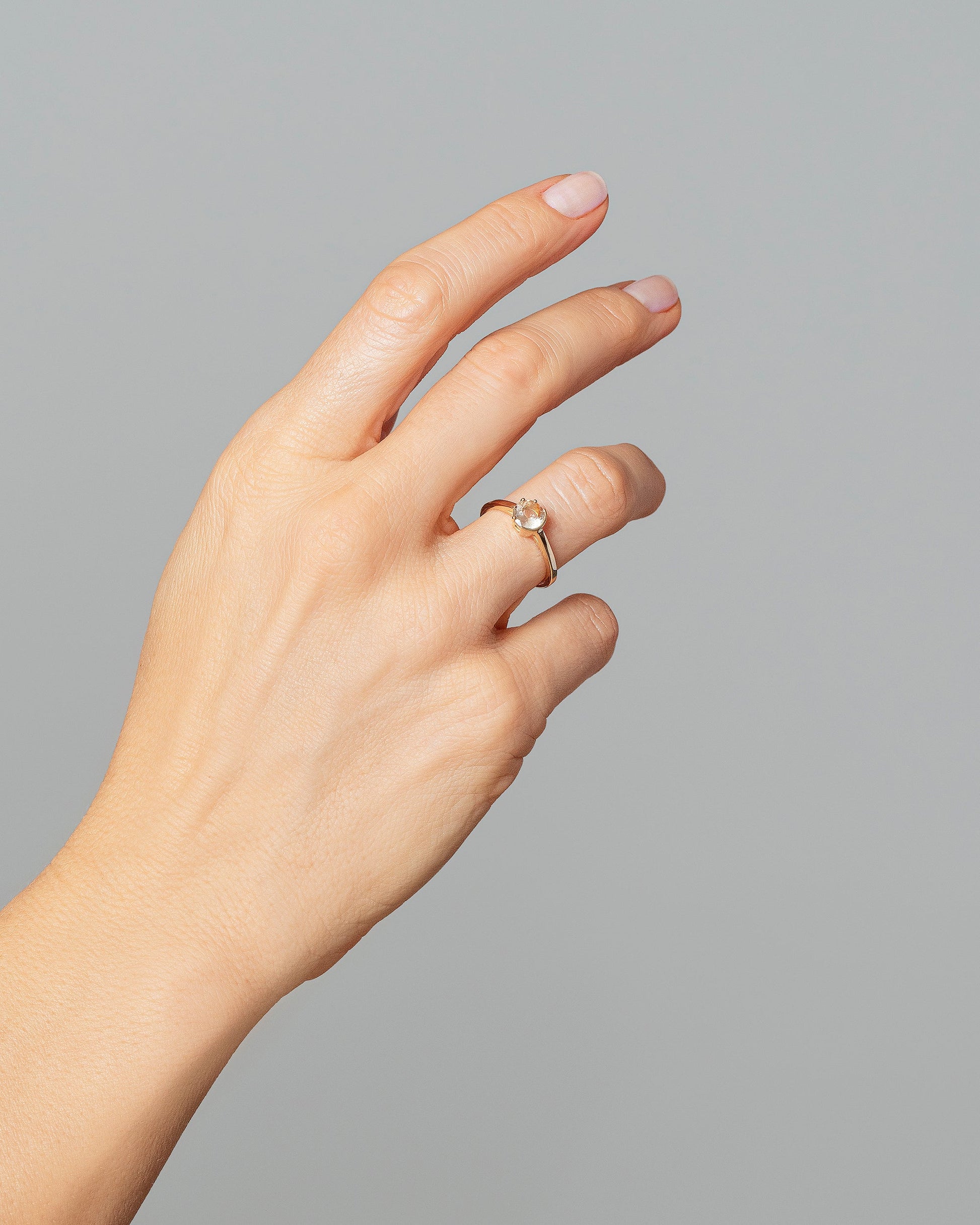 Sun & Moon Ring - Bicolor Yellow Sapphire on model.