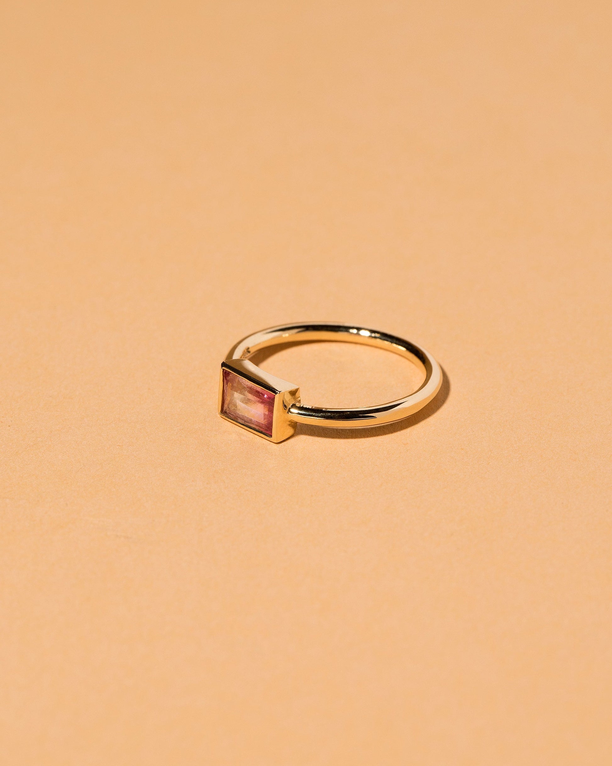 View from the side of the Pink & White Tourmaline Ring on light color background.