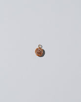 Cinnamon Roll Charm - Enamel  on light colored background