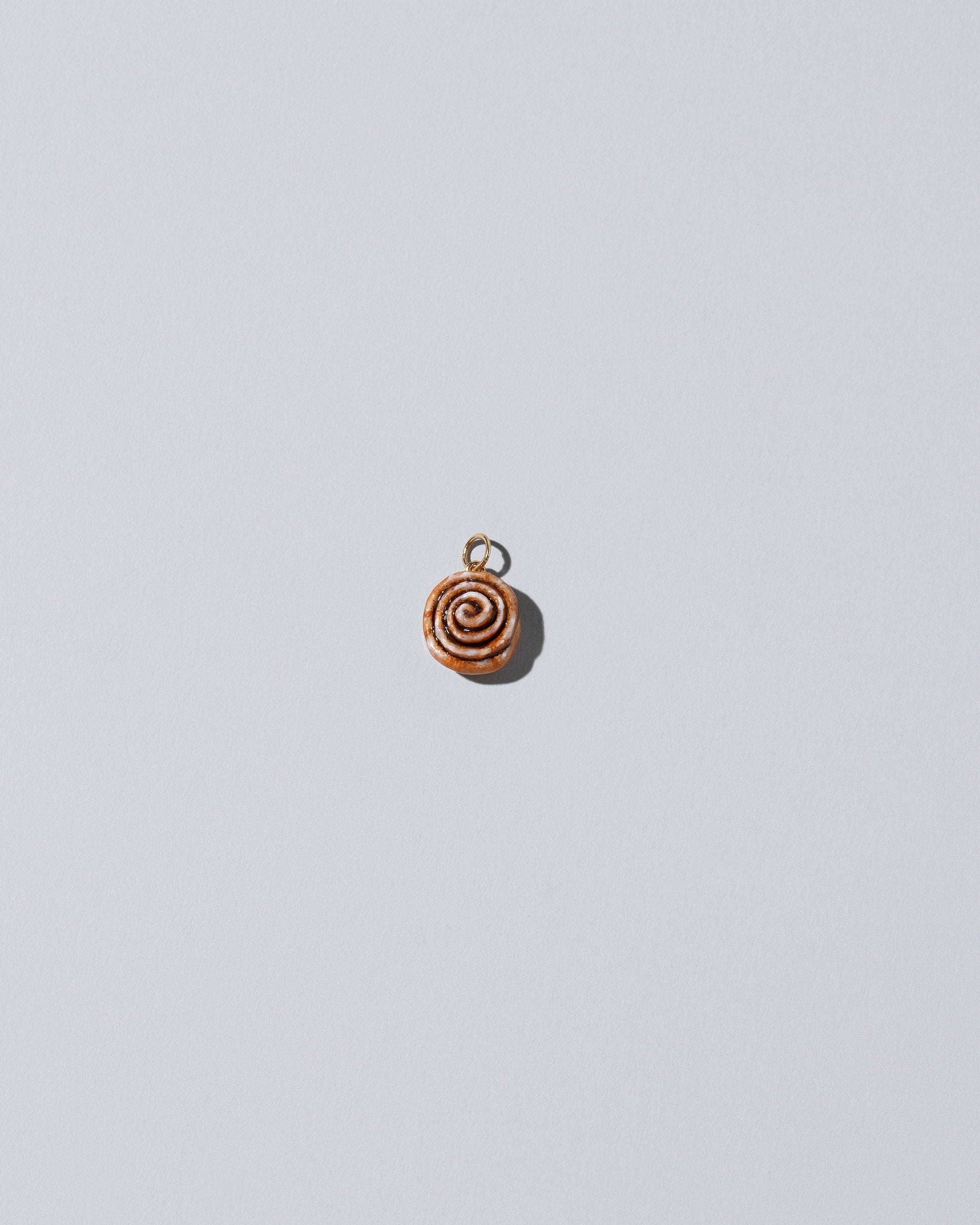 Cinnamon Roll Charm - Enamel  on light colored background