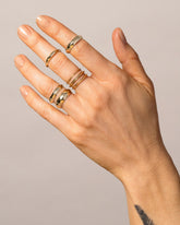 Gold Knife Edge Bands on model.
