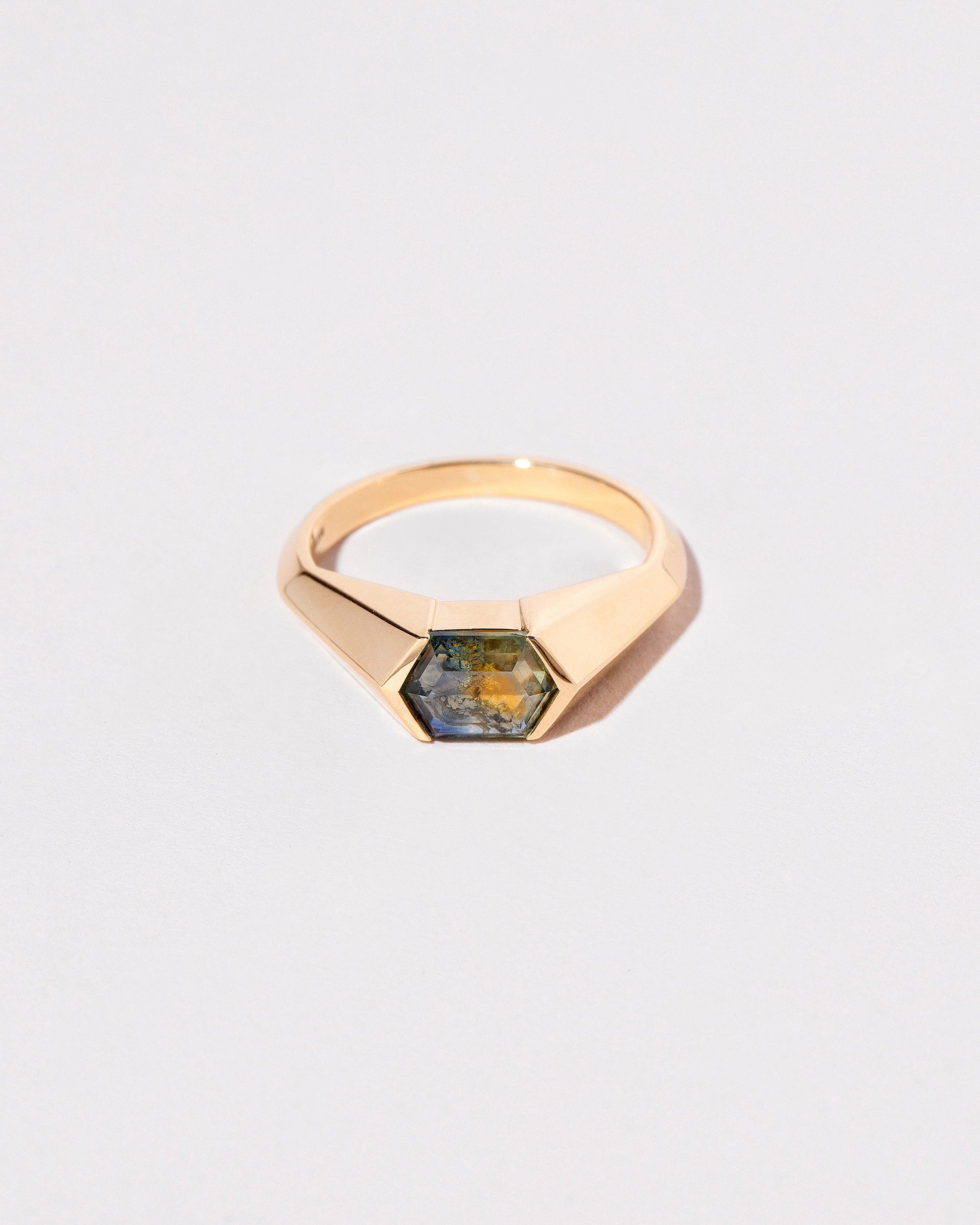 Caelum Ring on light color background.
