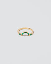 Emerald Baguette Bridge Band on light color background.