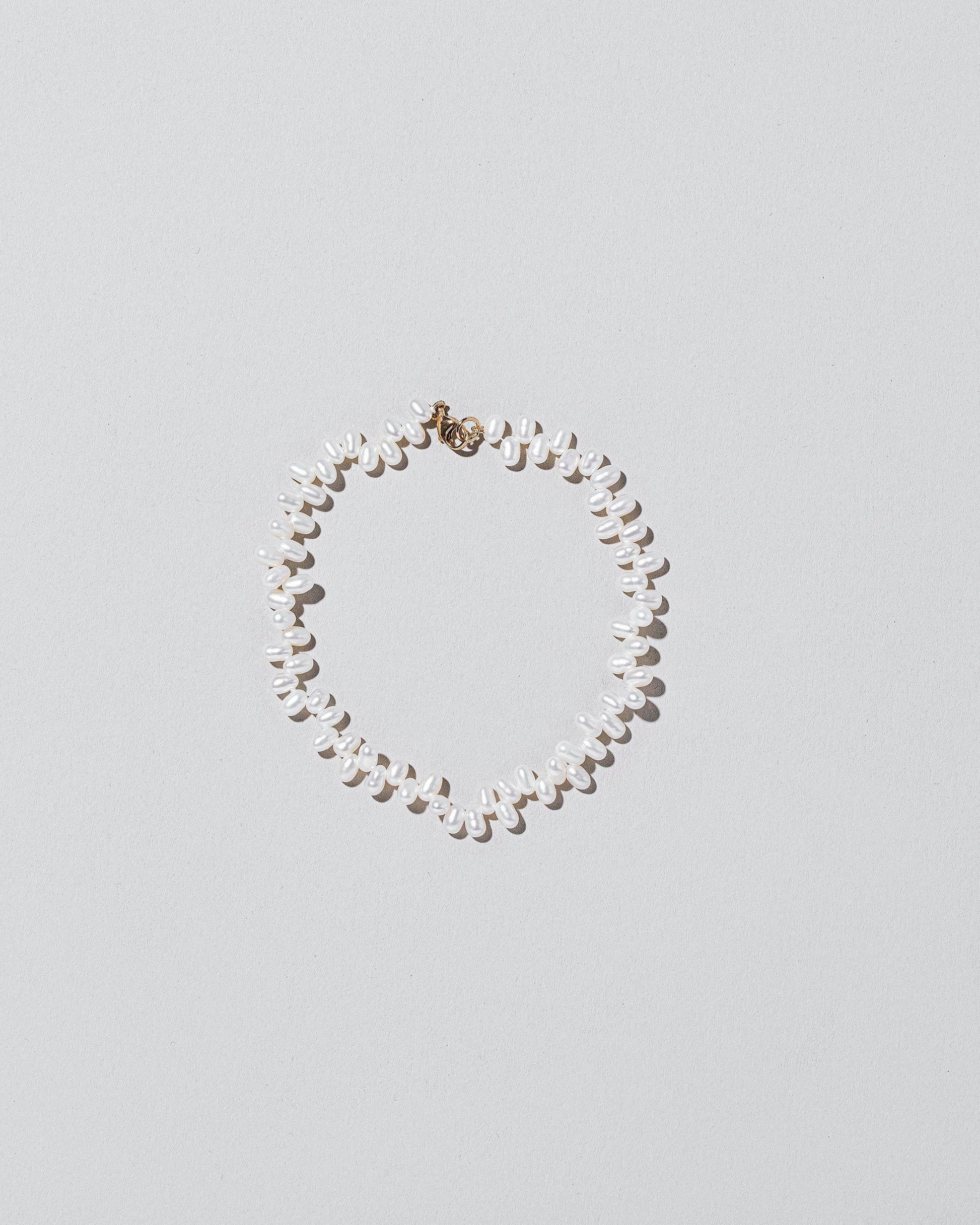  Zipper Pearl Bracelet on light color background.