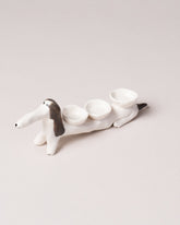 Eleonor Boström Spots Baggage Dog on light color background.