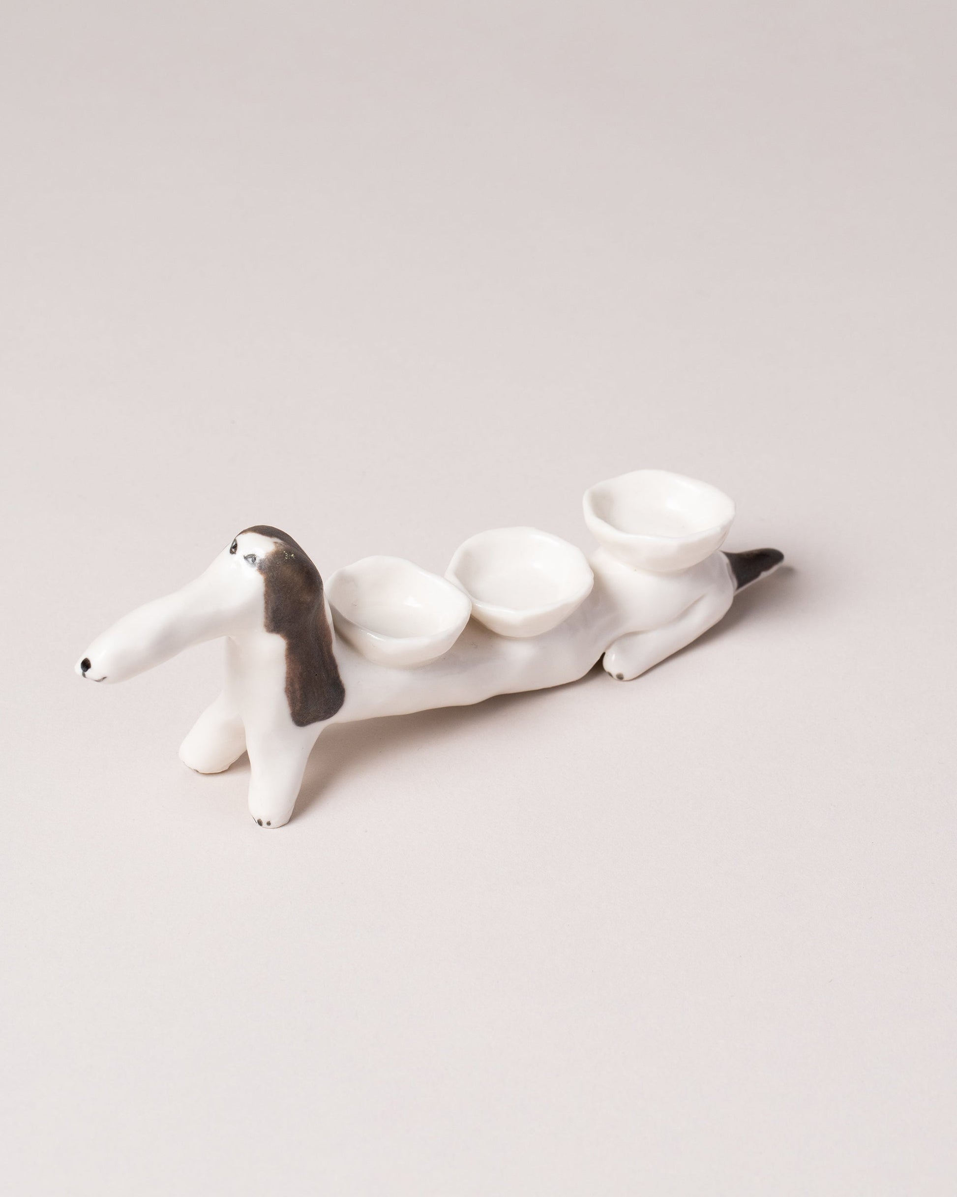 Eleonor Boström Spots Baggage Dog on light color background.