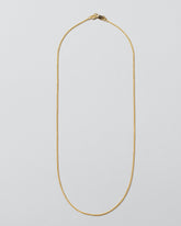  Cycle Chain Necklace on light color background.