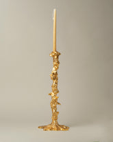POLSPOTTEN Gold Large Drip Candle Holder on light color background.