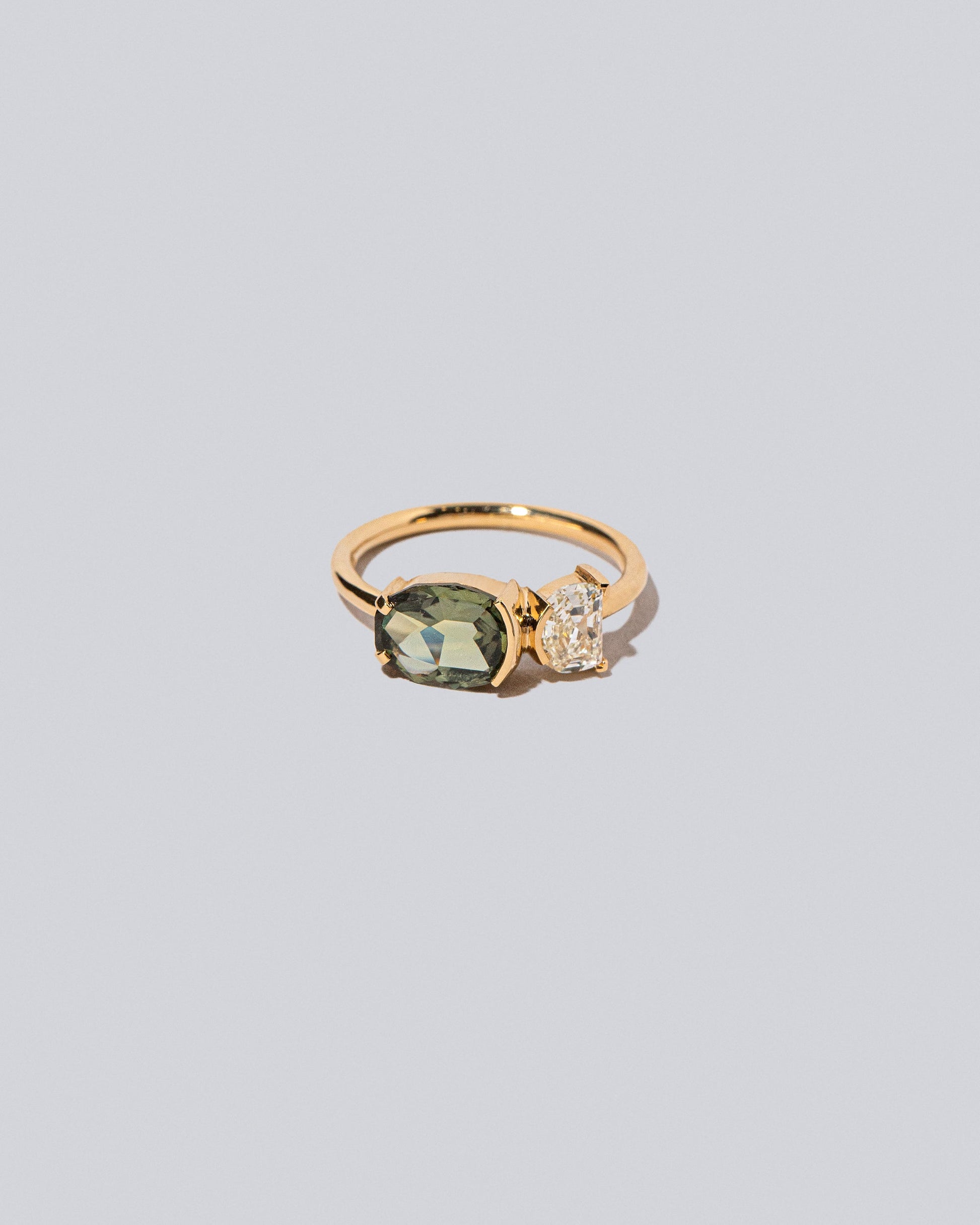 Product photo of Finch Ring on a light color background 
