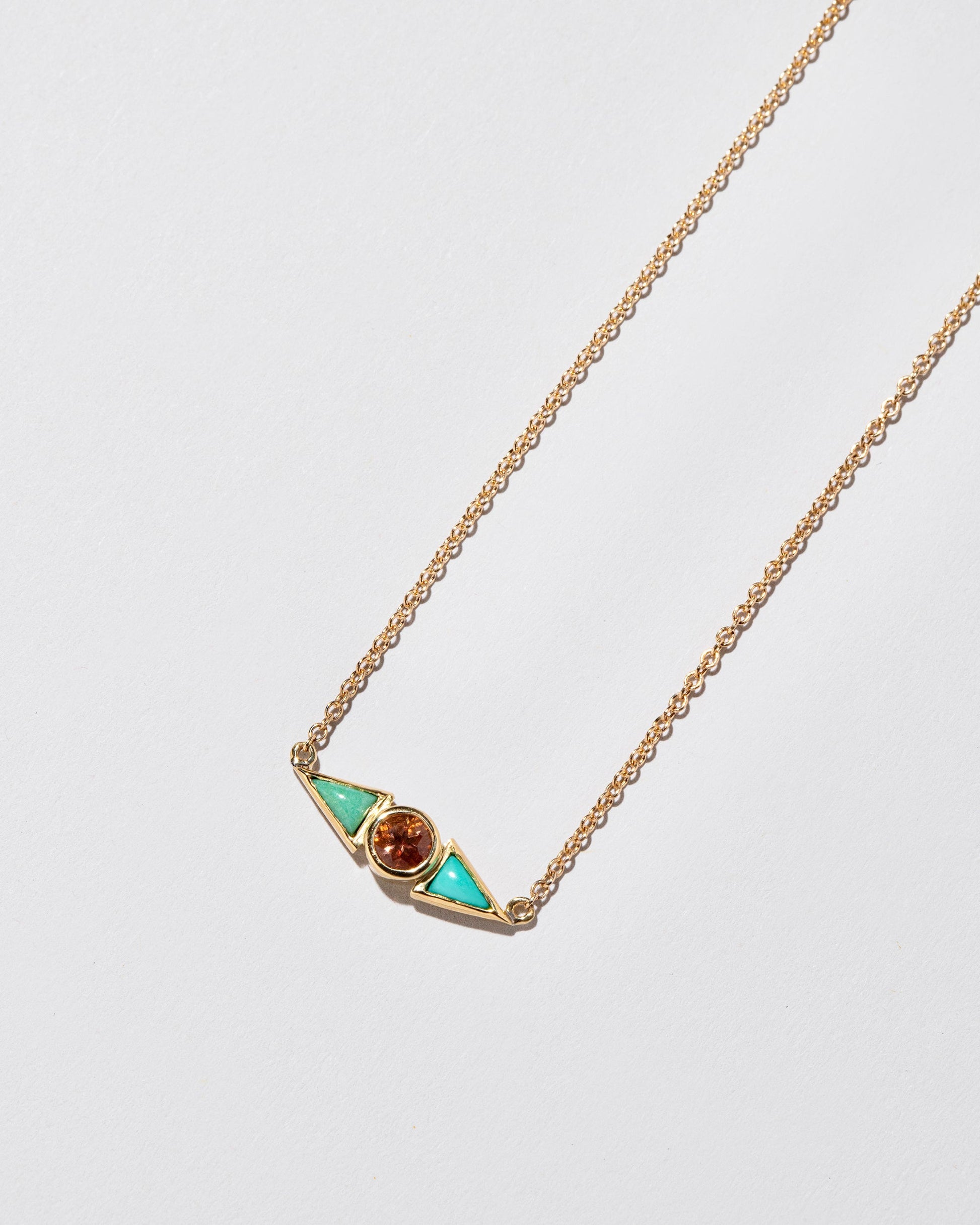  Sunstone & Turquoise Eye Necklace on light color background.