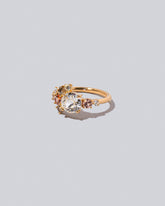 Product photo of the Peach Vega Ring on a light color background. 