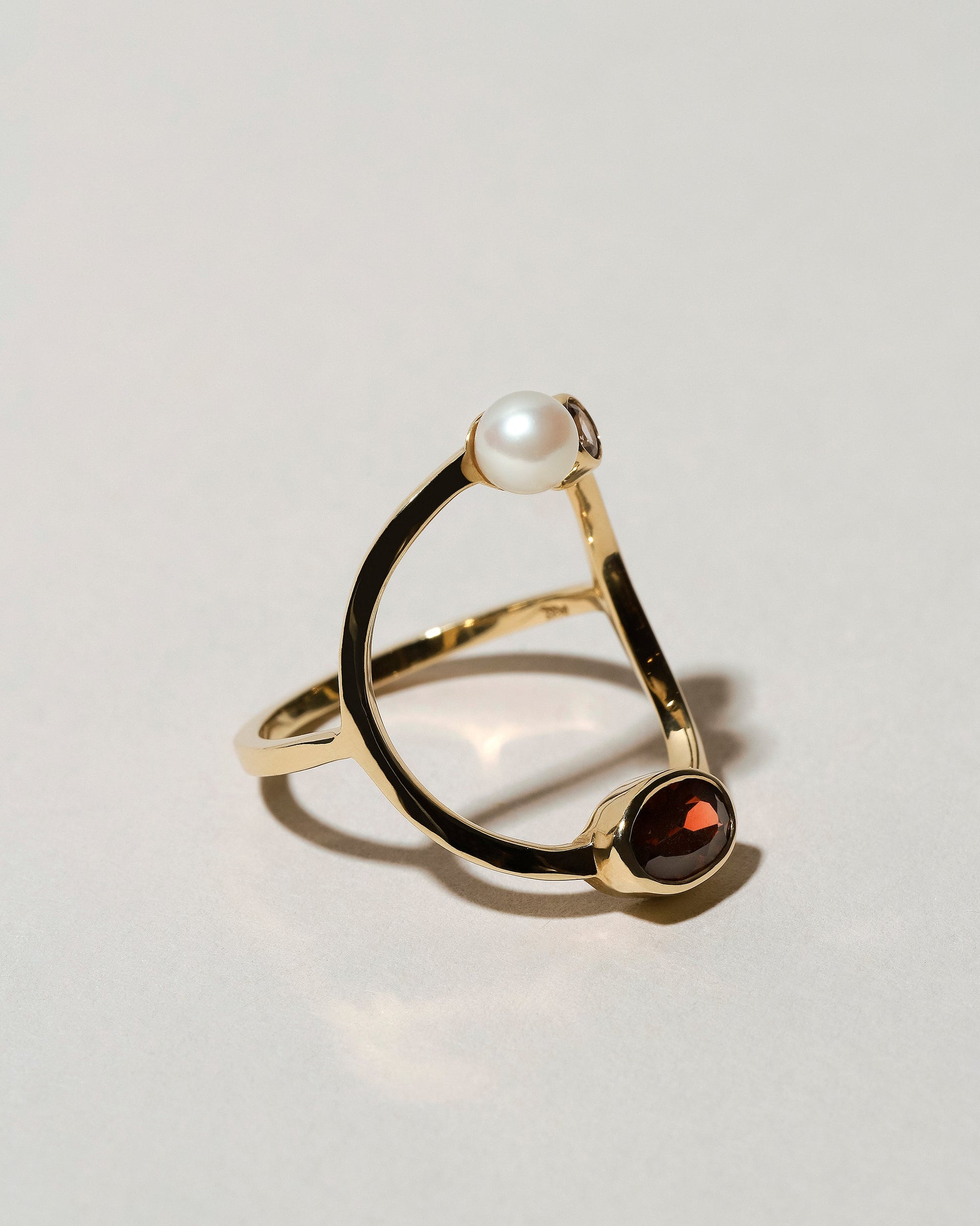  Trilogy Ring - Garnet on light color background.