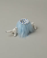 Closeup detail of the Eleonor Boström Blue Furry Baggage Dog on light color background.