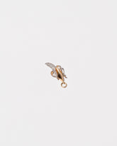 View from the side of the Peeled Banana Charm on light color background.