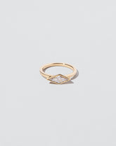 Atomism Ring on light color background.