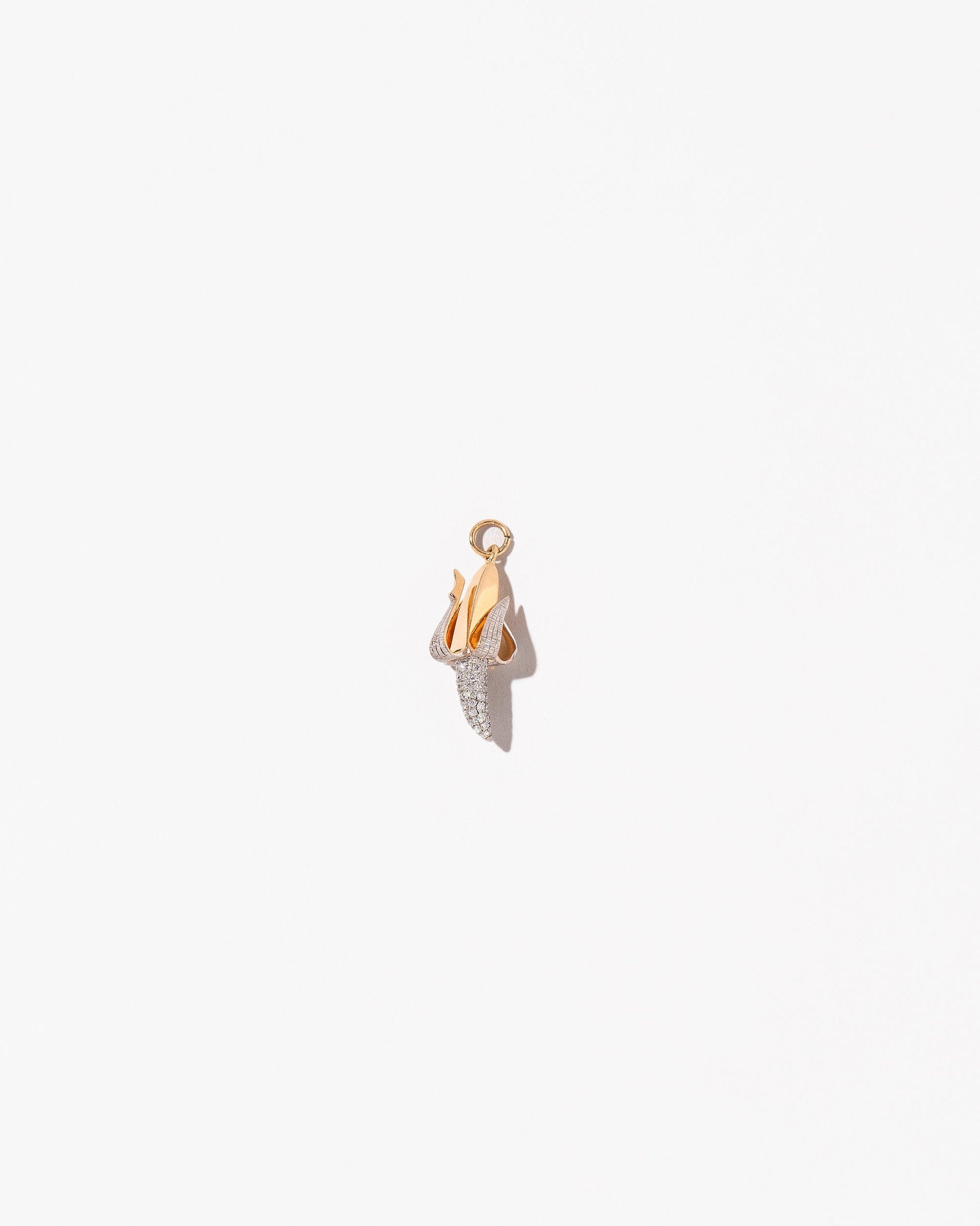 Peeled Banana Charm on light color background.