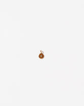 Orange Slice Charm on light color background.