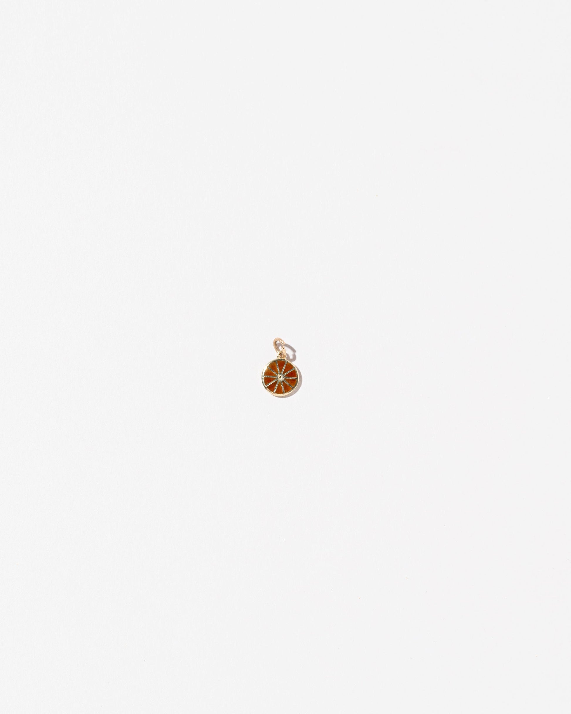 Orange Slice Charm on light color background.