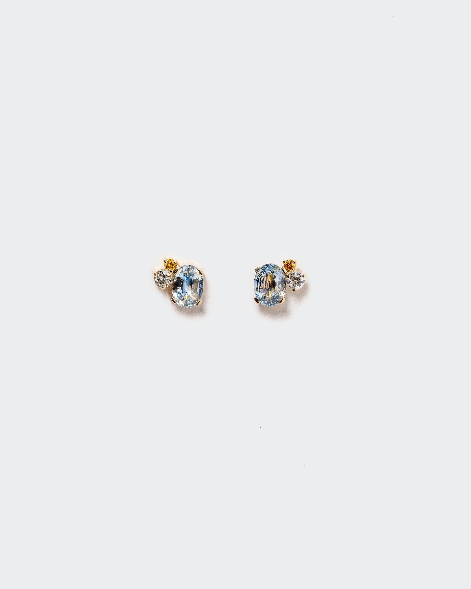  Oscillating Earrings on light color background.