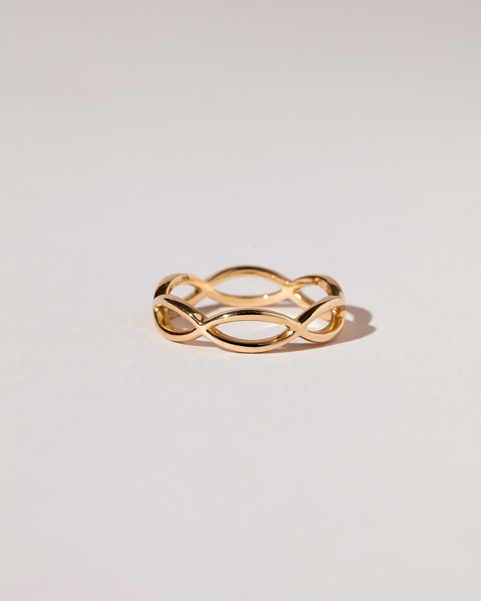 Gold Connected Eye Band on light color background.