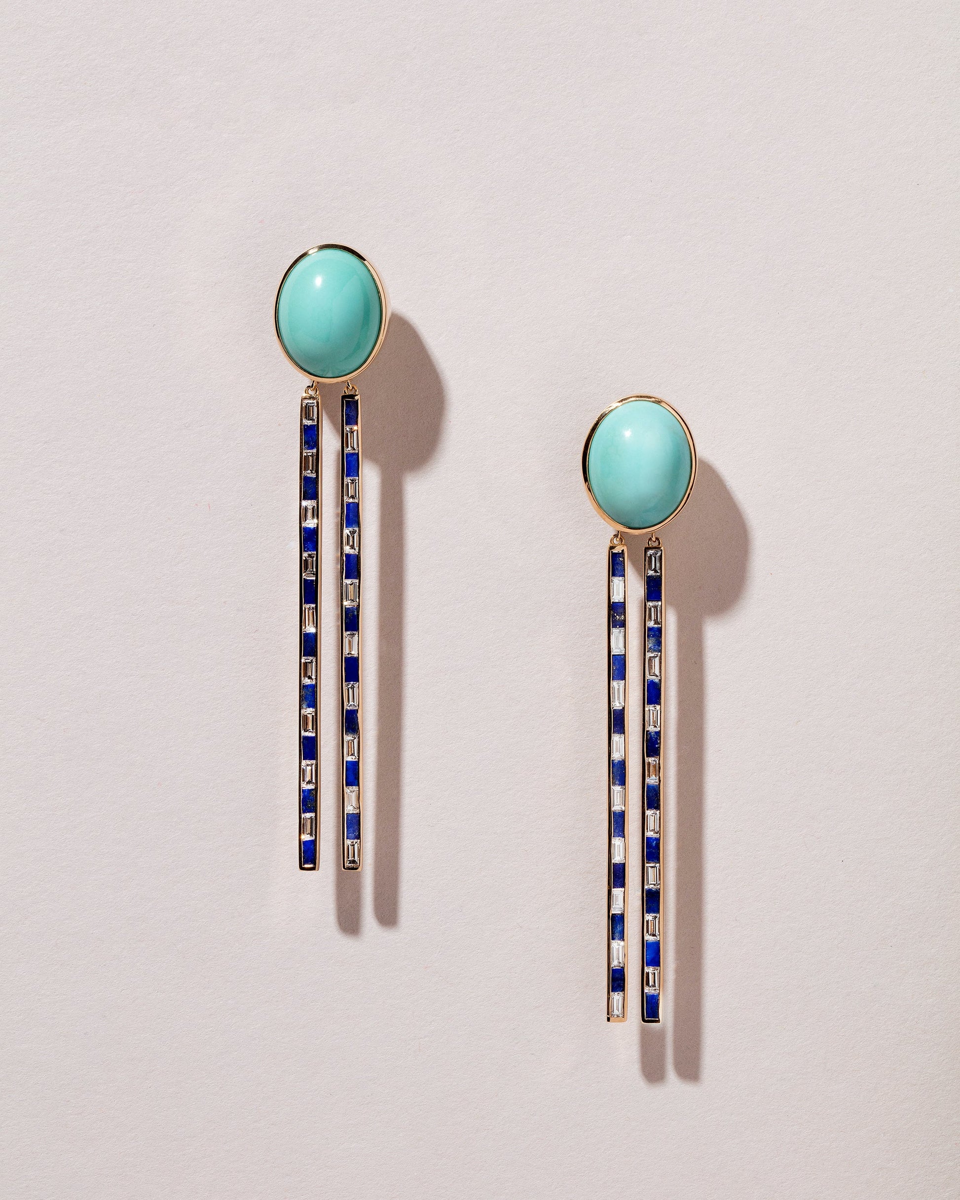  Spiritual Transformation Earrings on light color background.